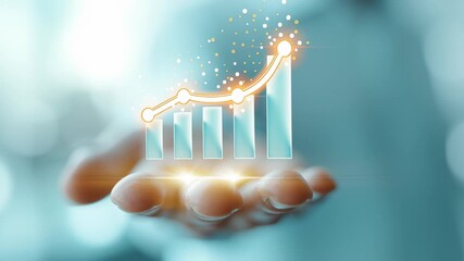 Hand displays glowing bar chart symbolizing financial progress and growth. Bright background suggests modern office environment. Concept of finance, business development, investment strategies - Powered by Adobe