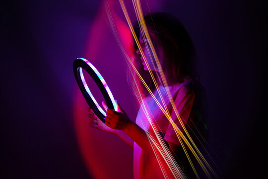 Blogger content creator using mobile phone gadget. Woman blogger influencer creating vlog video for social media.