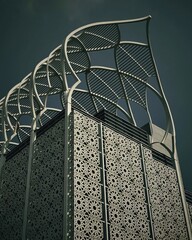 Modern building with intricate geometric patterns and leaf-shaped architectural details.