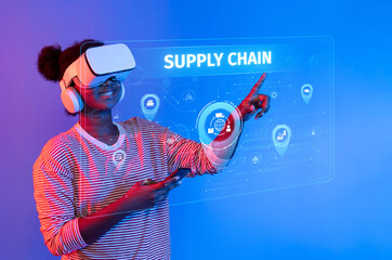 A young woman wearing a virtual reality headset engages with digital graphics that illustrate...