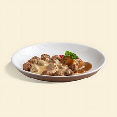 Swedish meatballs with gravy and mashed potatoes on a plate.