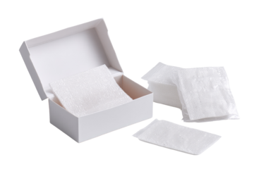 White rectangular box containing several white, absorbent pads