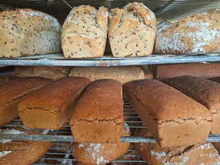 attractive and appetizing breads on a rack just out of the oven