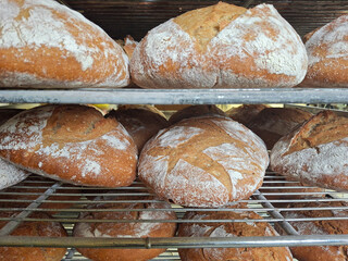 attractive and appetizing breads on a rack just out of the oven