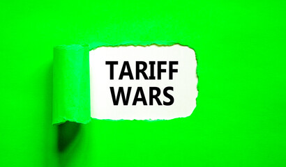 Trade tariff wars symbol. Concept word Tariff wars on beautiful white paper. Beautiful green paper background. Business trade tariff wars concept. Copy space.