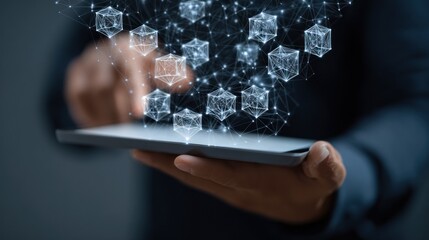 Hands holding tablet with digital cubes