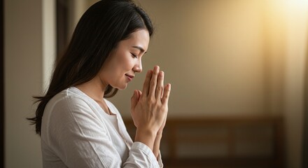 Close of a mother praying to Lord, expressing faith, care for her family, and devotion to Christ