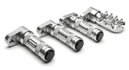 Four silver motorcycle foot pegs with black rubber caps arranged on a white background surface