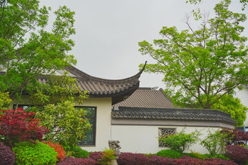 Nantong, Jiangsu, China: 04 21 2025: Beautiful Jiangsu traditional Chinese building, Roof, wall, tile and door