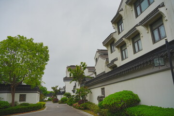 Nantong, Jiangsu, China: 04 21 2025: Beautiful Jiangsu traditional Chinese building, Roof, wall, tile and door