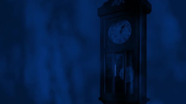 Tree Shadows Over Antique Clock At Night
