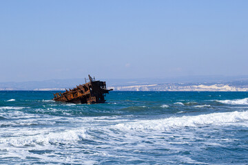 sunken ship with white waves