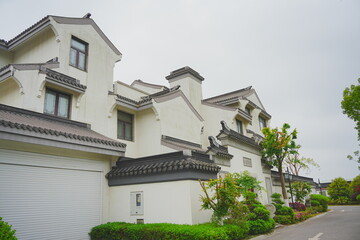 Nantong, Jiangsu, China: 04 21 2025: Beautiful Jiangsu traditional Chinese building, Roof, wall, tile and door
