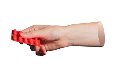 Closeup of hand with red blister pack. Representation of medical drugs, pills, and prescription