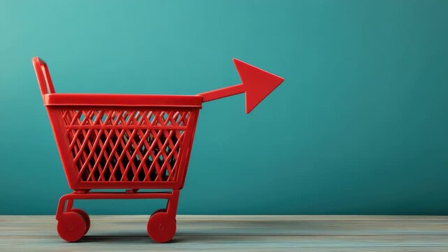Red shopping cart with arrow on teal background