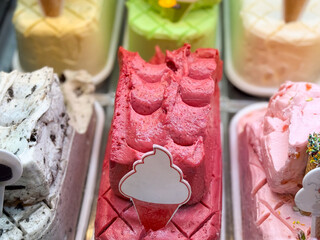 Bright gelato flavors on display. Dessert, color, and culinary art in frozen sweets.