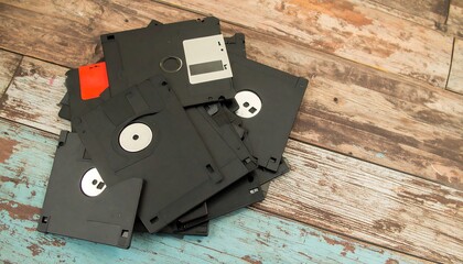 Vintage floppy disks on weathered wood