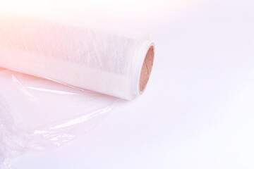 Packaging material. Stretch film and cardboard packaging on a white background. Packing the goods before shipping..