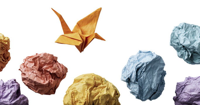 Origami crane amidst crumpled papers