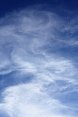 Backgrounds. Cloudscape. Deep blue sky with beautiful cirrus and cirrostratus clouds. Portugal.	