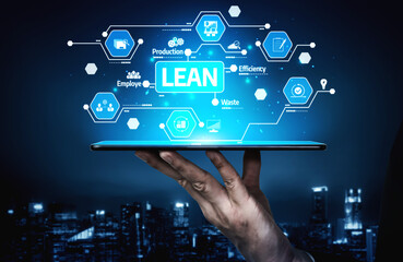A hand holds a tablet displaying a modern digital interface representing lean management to enhance efficiency and reduce waste in business processes. Tessel
