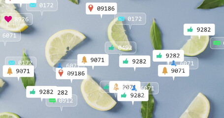 Displaying lemon-lime wedges and green leaves on blue surface, with floating social media icons