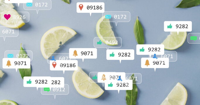 Fototapeta Displaying lemon-lime wedges and green leaves on blue surface, with floating social media icons
