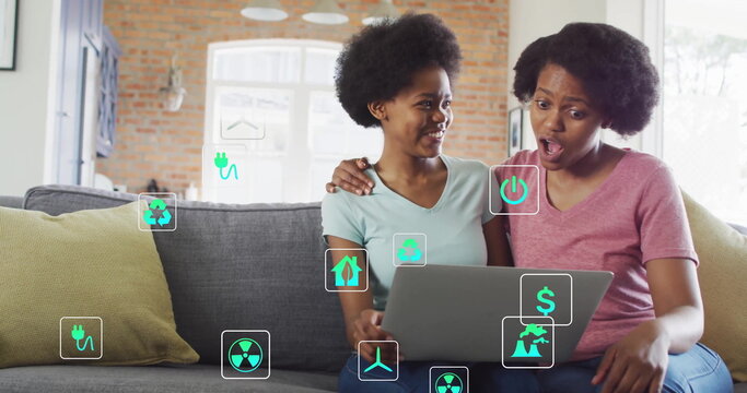 Exploring mother and daughter navigating renewable energy options in living room, with eco icons