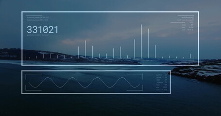 Displaying data panels over rocky coastline at dusk, showing numeric readout, bar graphs waveform