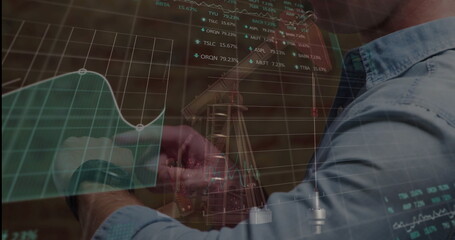 Adjusting musician tuning guitar headstock in studio, with market data overlay, copy space