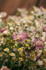 a vertical selective focus shot of flowers and greenery