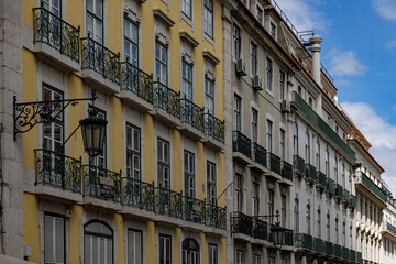 Colorful historic building facades with balconies in Lisbon
