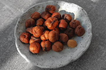 Roasted hazelnuts. Prepared from the hazelnut harvest. Hazelnut kernels are laid out on a handmade plate