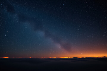 Fototapeta premium Starry Night Above the Clouds