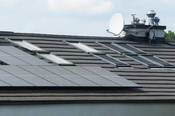 Photovoltaic solar panels, modern sustainable home. Energy-saving rooftop system with photovoltaic...