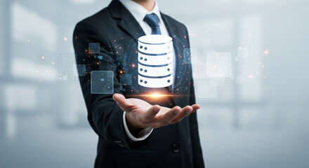 Professional businessman presents digital database concept with glowing data icons and futuristic interface elements