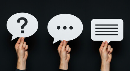 Hands holding speech bubbles with question mark ellipsis and text symbolizing communication and inquiry