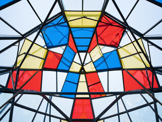 Geometric stained glass ceiling with primary colors