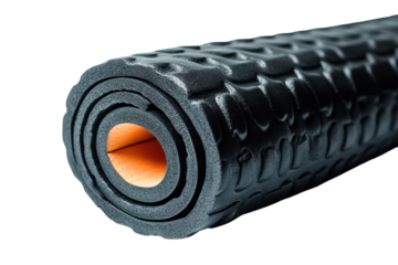 Rolled black foam roller with orange interior for fitness and self-massage on white background