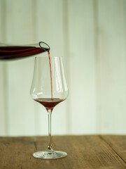 pouring red wine in a glass