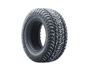 Close-up of a dark gray/black all-terrain tire.  Its tread pattern is deeply grooved, creating a textured, aggressive look.  The tire is presented against a black background