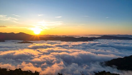 Sunrise over a sea of clouds, mountain peaks
