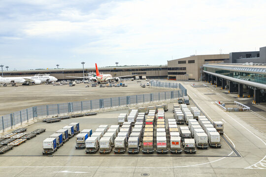 Ground Handling services, Cargo containers wait for loaded into an airliner at Airport.