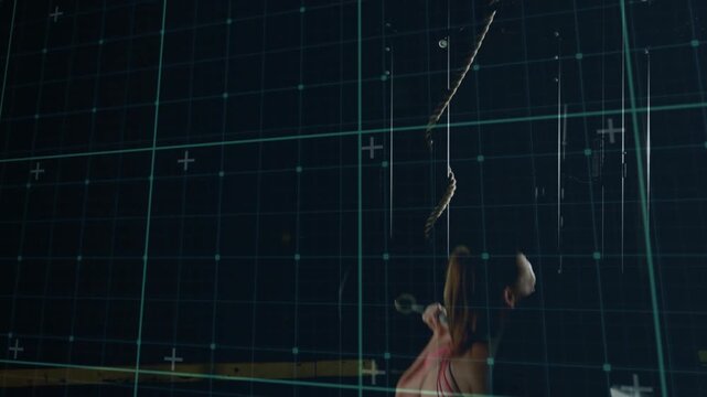 Bracing core gripping barbell, athlete lowering into squat for fitness analysis with grid overlay