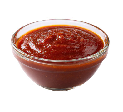 A small, clear glass bowl filled with a rich, red BBQ sauce