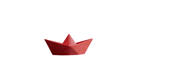 Red origami boat on black background