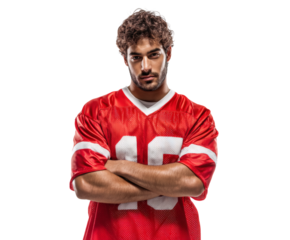 The football player in a red jersey shows confidence with arms crossed, ready for the game.