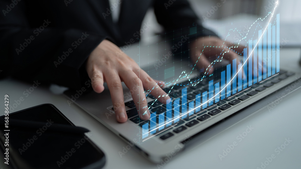 Poster a business professional engages with data analytics on a laptop, featuring digital graphs that illus