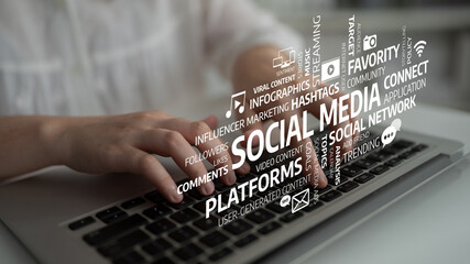 A person engages in social media content creation on a laptop, highlighting the importance of...