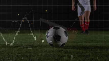 Player taking steps on night pitch kicking soccer ball, with finance overlay demonstrating trends - Powered by Adobe